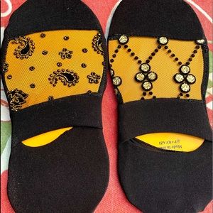 Two pairs of socks for a women.